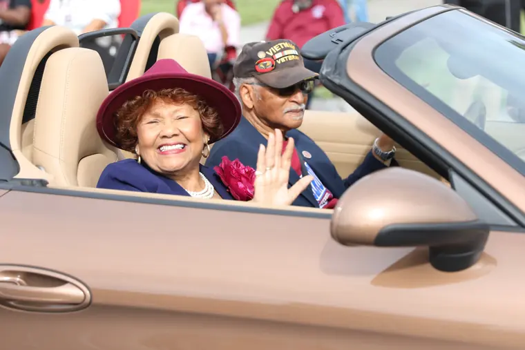 SC State alumni waving from a parade convertible