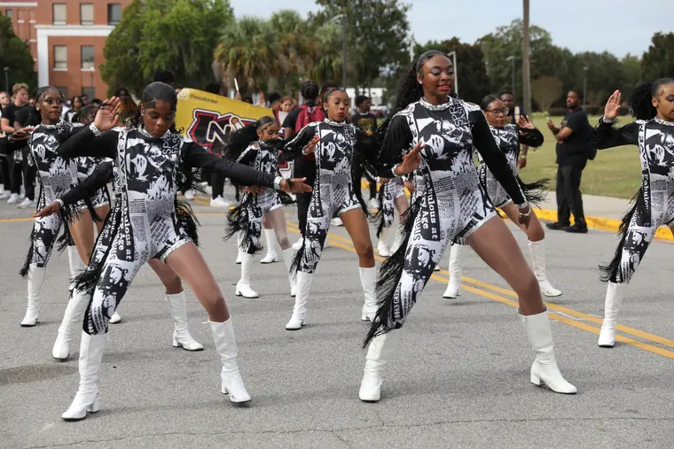 A dance team performing in the Homecoming Parade