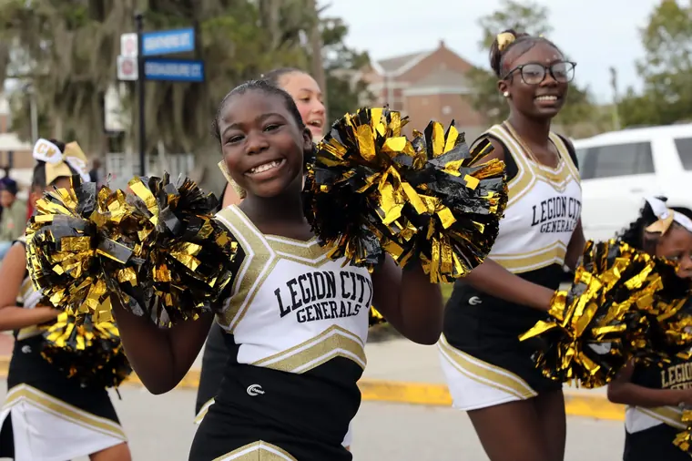 Youth cheerleaders performing in the Homecoming Parade