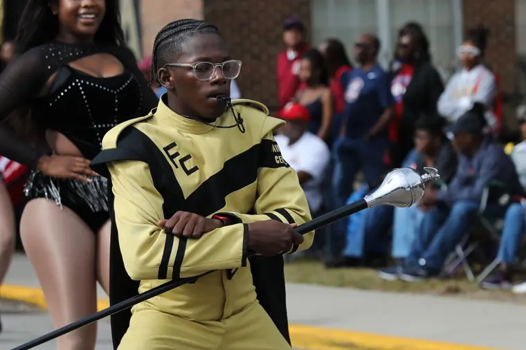 A drum major performing during the Homecoming Parade