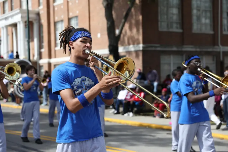 A trombone player performing in the Homecoming Parade